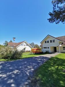 a driveway leading to a house with a garage at BiG Bed & Breakfast in Grimstad