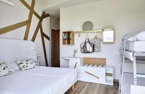 A bed or beds in a room at Hotel La Fenice