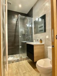 a bathroom with a shower and a toilet and a sink at Le Mattoni 2 in Menton