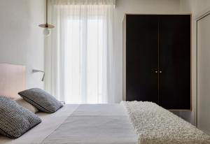 A bed or beds in a room at Hotel La Fenice