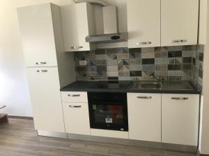 Kuchyň nebo kuchyňský kout v ubytování Apartments Lena