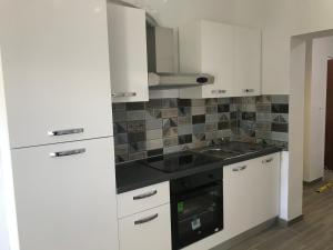 Kuchyň nebo kuchyňský kout v ubytování Apartments Lena