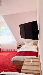 Postel nebo postele na pokoji v ubytování Hanse Hotel