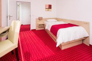 Postel nebo postele na pokoji v ubytování Hanse Hotel