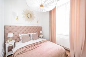 Łóżko lub łóżka w pokoju w obiekcie Apartament Golden Place