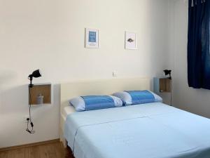 Кровать или кровати в номере Apartments Pijaza