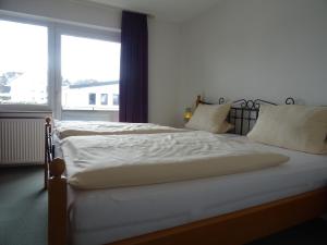 Postel nebo postele na pokoji v ubytování Aktiv Hotel Winterberg