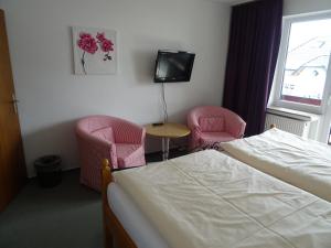Postel nebo postele na pokoji v ubytování Aktiv Hotel Winterberg