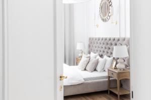 Łóżko lub łóżka w pokoju w obiekcie Apartament Golden Place