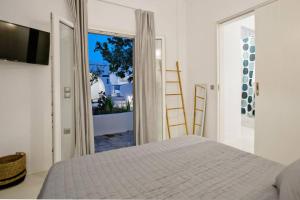 Кровать или кровати в номере Beachside Villa Agios Sostis