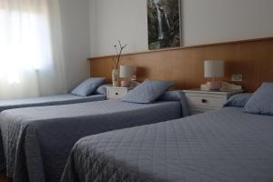 Posteľ alebo postele v izbe v ubytovaní Albergue Turístico Silleda