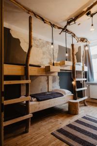 a bedroom with two bunk beds in a room at The Keep Eco Rooms in Salzburg