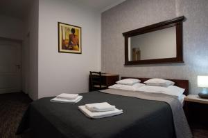 Postel nebo postele na pokoji v ubytování Carnival City Hotel Oradea