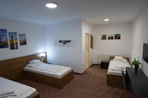 Postel nebo postele na pokoji v ubytování Carnival City Hotel Oradea