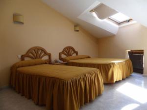 Postel nebo postele na pokoji v ubytování Hotel Laberinto