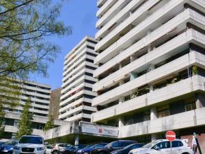 a parking lot in front of a tall building at Liebelei in Bad Harzburg