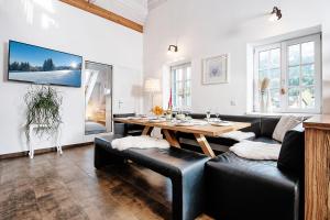 a living room with a table and a couch at Haus Herzog in Tröpolach