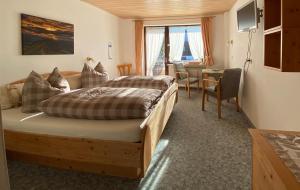 Postel nebo postele na pokoji v ubytování Landhaus Nagelfluh + 7 fotografií