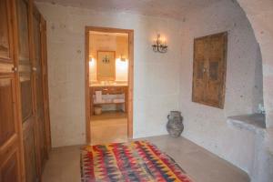 A bed or beds in a room at Les Maisons De Cappadoce