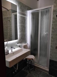 a bathroom with a sink and a shower at Hotel La Vignetta in Milan +20 photos