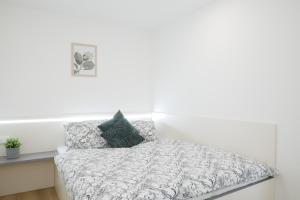 Postel nebo postele na pokoji v ubytování COMFORT Rožnov + 18 fotografií