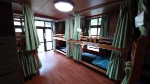 Voodi või voodid majutusasutuse Kerama Backpackers toas