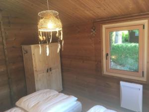 Postel nebo postele na pokoji v ubytování Chalet Le Cactus avec sauna privatif
