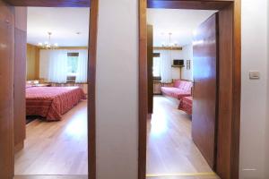 Postel nebo postele na pokoji v ubytování Hotel Principe