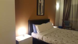 Postel nebo postele na pokoji v ubytování B&B in Arena L' Opera