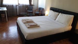 Postel nebo postele na pokoji v ubytování B&B in Arena L' Opera