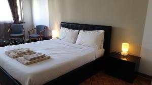 Postel nebo postele na pokoji v ubytování B&B in Arena L' Opera