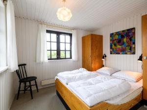 Postel nebo postele na pokoji v ubytování Holiday home Fanø LI