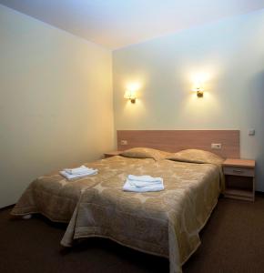Postel nebo postele na pokoji v ubytování Hotel SPA Arkadia + 32 fotografií