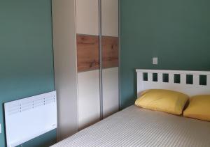 a bedroom with a bed and a white cabinet at Lux Apartment in the city center in Štip