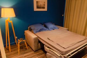 Кровать или кровати в номере Fleur de Lys - St Denis Providence GR - ONF