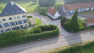 an aerial view of a house and a road in a village at B&B au petit tambour d'Autingues in Autingues