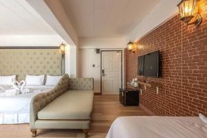 Postel nebo postele na pokoji v ubytování SUDYOD HOTEL