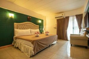Postel nebo postele na pokoji v ubytování SUDYOD HOTEL