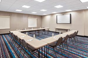 a conference room with tables and chairs in it at La Quinta by Wyndham Pasadena North in Pasadena