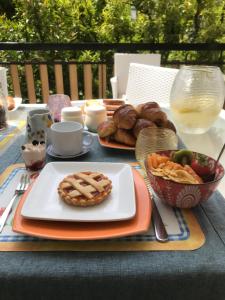 a table with a plate of food and a bowl of bread at Casa Dolce Casa Ruvo in Ruvo di Puglia