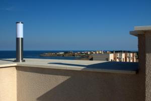 a view of the ocean from the balcony of a building at Seagarden Villa Resort in Lozenets