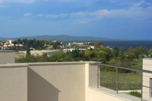 a view of the ocean from the balcony of a house at Seagarden Villa Resort in Lozenets