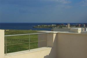 a view of the ocean from the balcony of a building at Seagarden Villa Resort in Lozenets