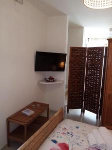 A television and/or entertainment centre at Sweet Home by Giò