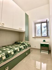 Säng eller sängar i ett rum på Terrazza sul mare Pisciotta - Palinuro
