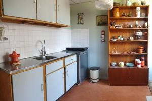 a kitchen with a sink and a counter top at appartement Kemperberg in Arnhem