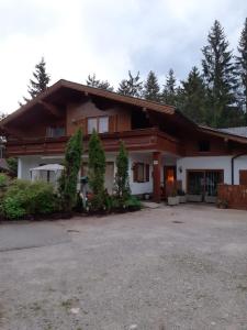 a large house with a driveway in front of it at Landhaus-Königsberg, Vorberg 360 in Ramsau am Dachstein