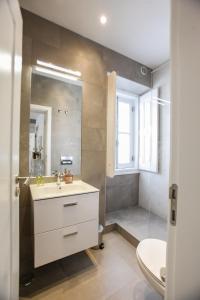 a bathroom with a sink and a shower at Casa dos Castelos in Évora