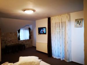 Telewizja i/lub zestaw kina domowego w obiekcie Pension Bella Vista