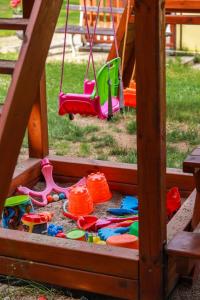 a play set with toys in a sandbox at Бунгала Камена - Bungalows Kamena in Kamena